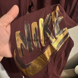 Nike Burgundy and black gold on the ankle